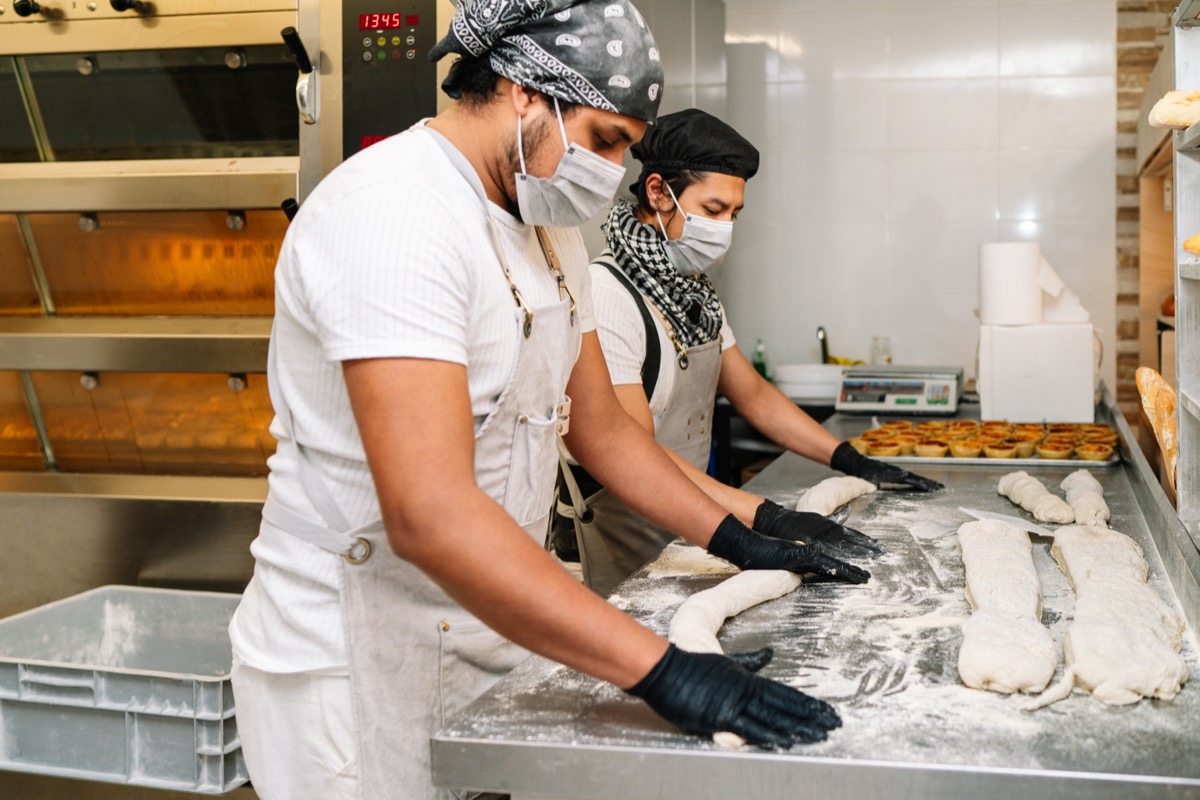 A professional baker preparing dough with Soheil Baking Powder.